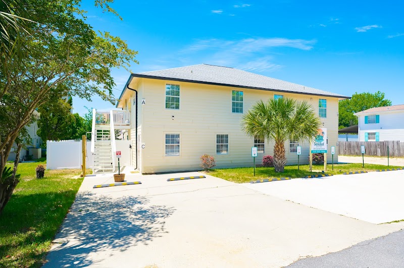 Front entrance of Sundial Suites — boutique vacation rental in Panama City Beach